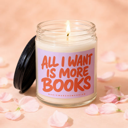 Candle with lit wick and "All I Want Is More Books" text on a lilac label.