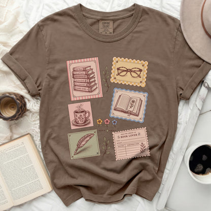 Brown t-shirt with literary-themed graphic featuring books and glasses.