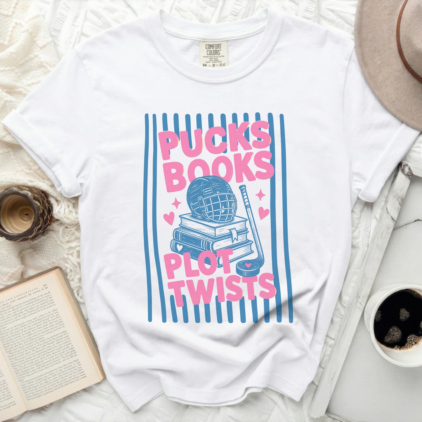T-shirt with "Pucks Books Plot Twists" text and hockey illustration.