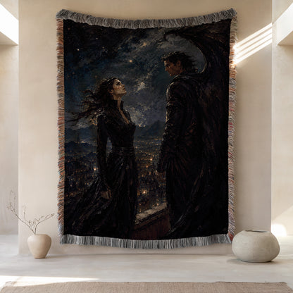 a large tapestry hanging on a wall, depicting a woman and a man standing together in a nighttime cityscape. The tapestry is framed by a decorative border and is placed between two small white vases.