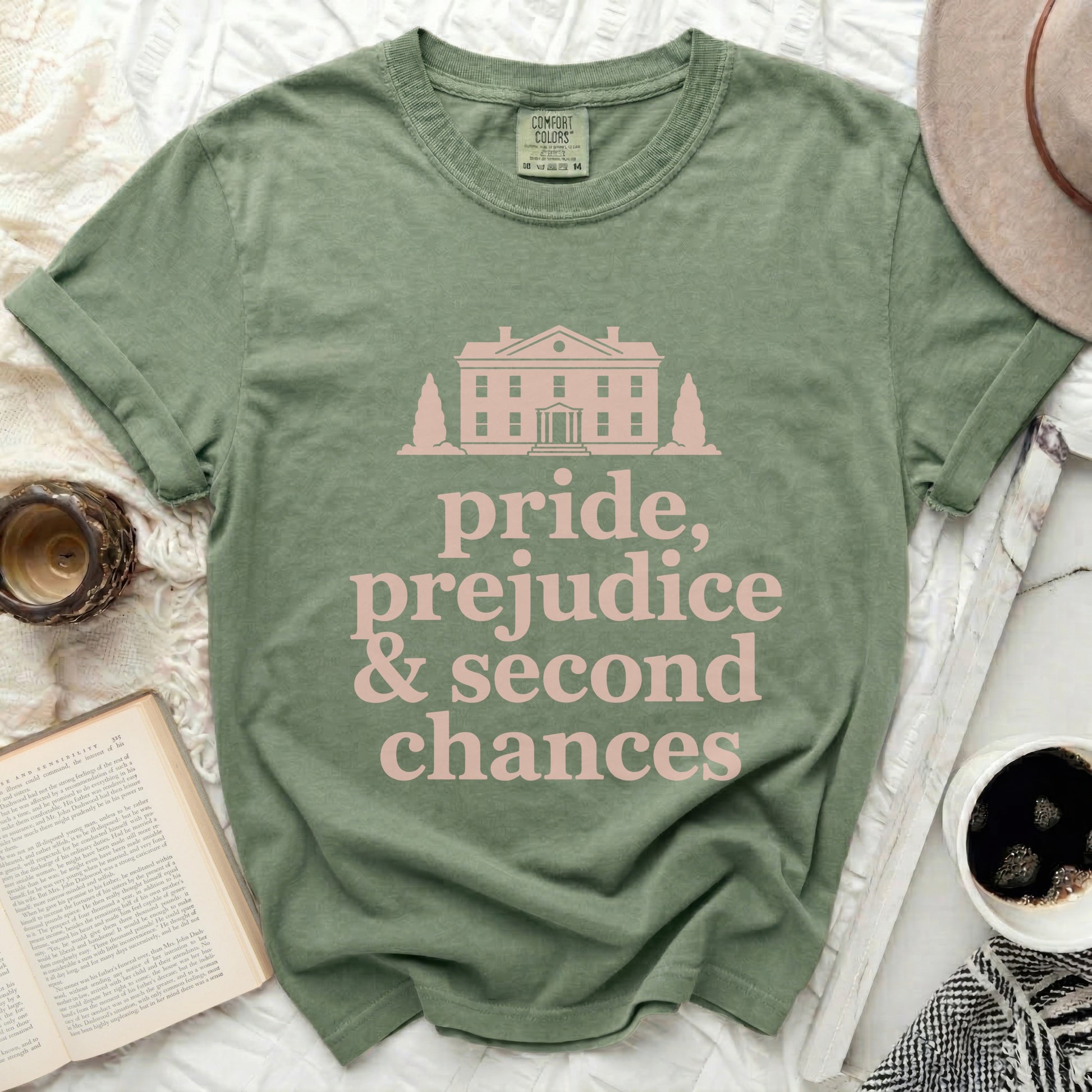 Sage t-shirt with pink text and house graphic, "Pride, Prejudice & Second Chances"