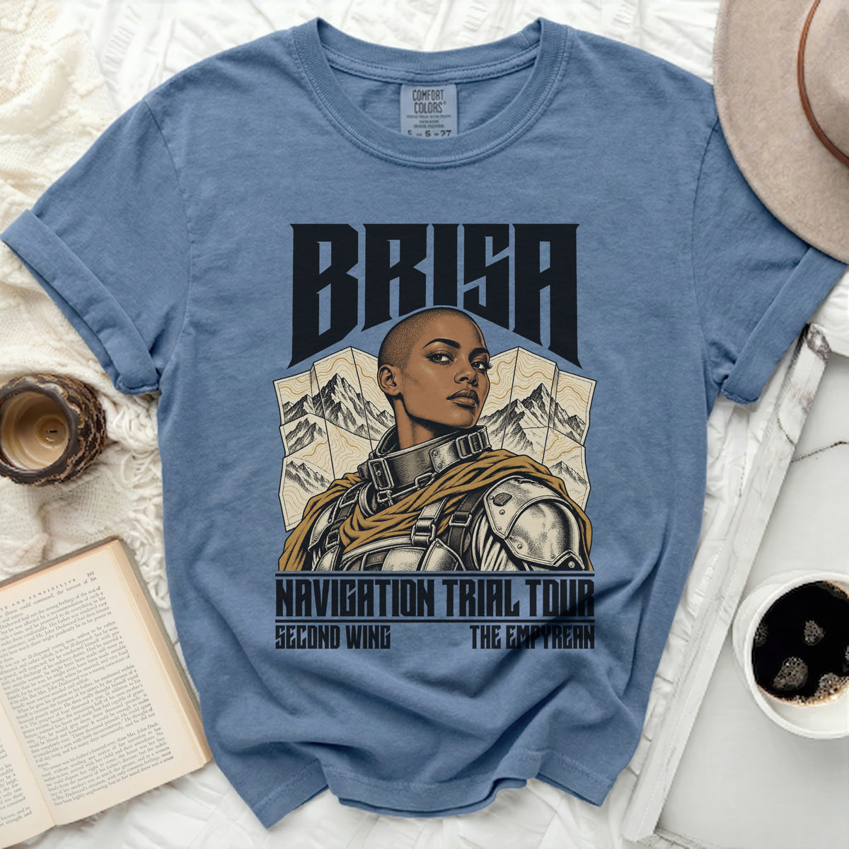 Blue t-shirt with Brisa "Navigation Trial Tour" graphic featuring a warrior woman.