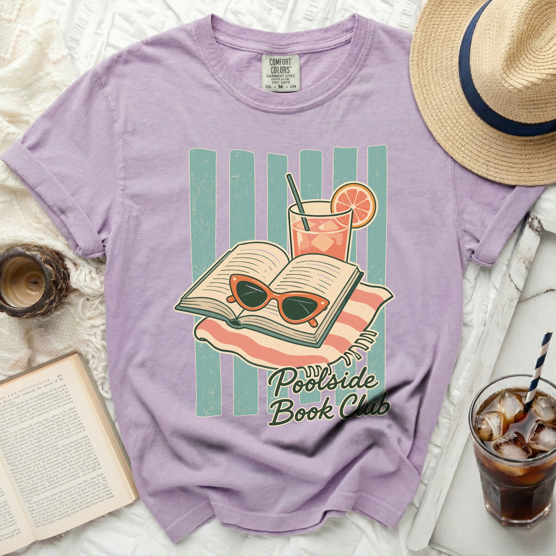 T-shirt with open book, sunglasses, and drink design.