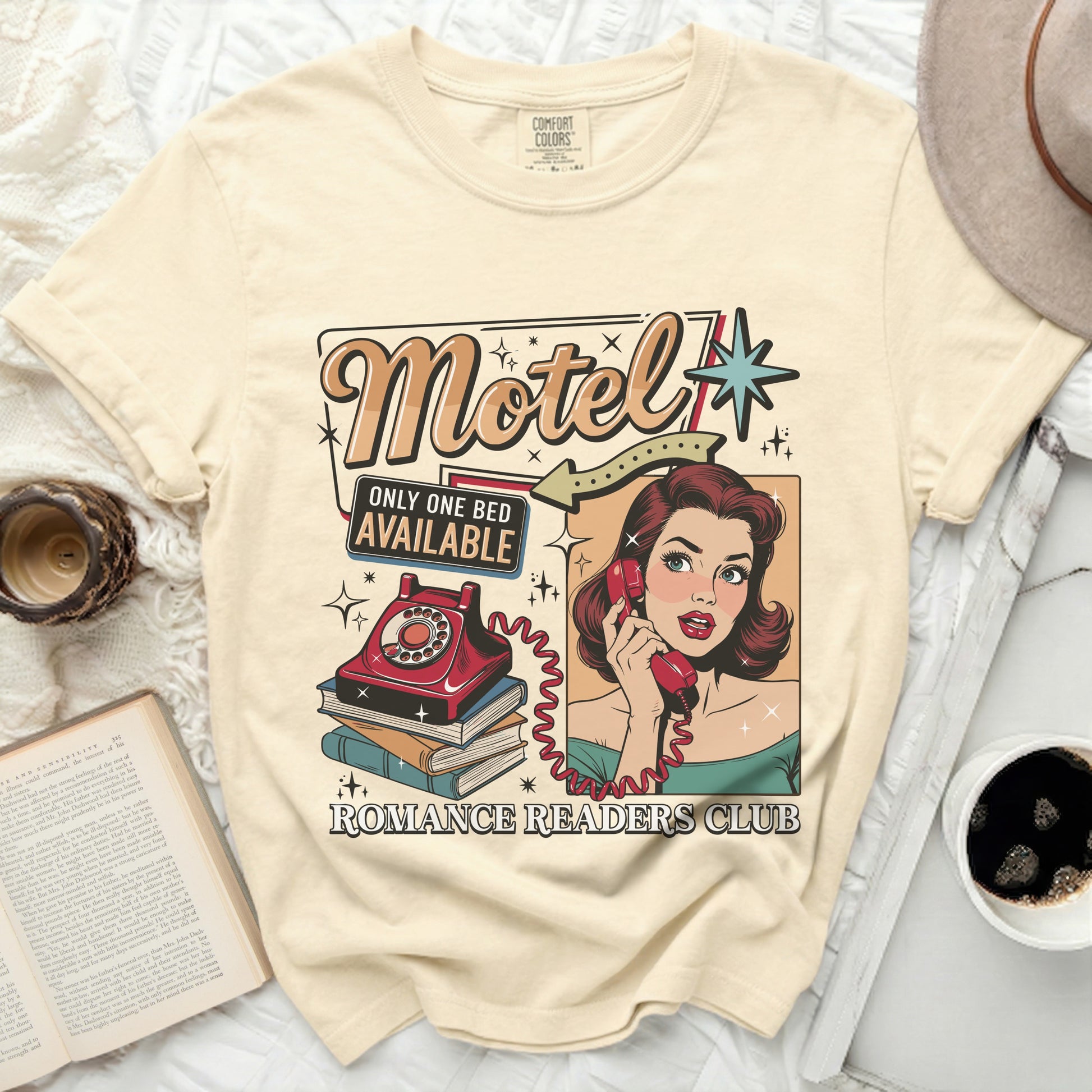 Cream t-shirt with "Motel," "Only One Bed Available," and "Romance Readers Club" text.