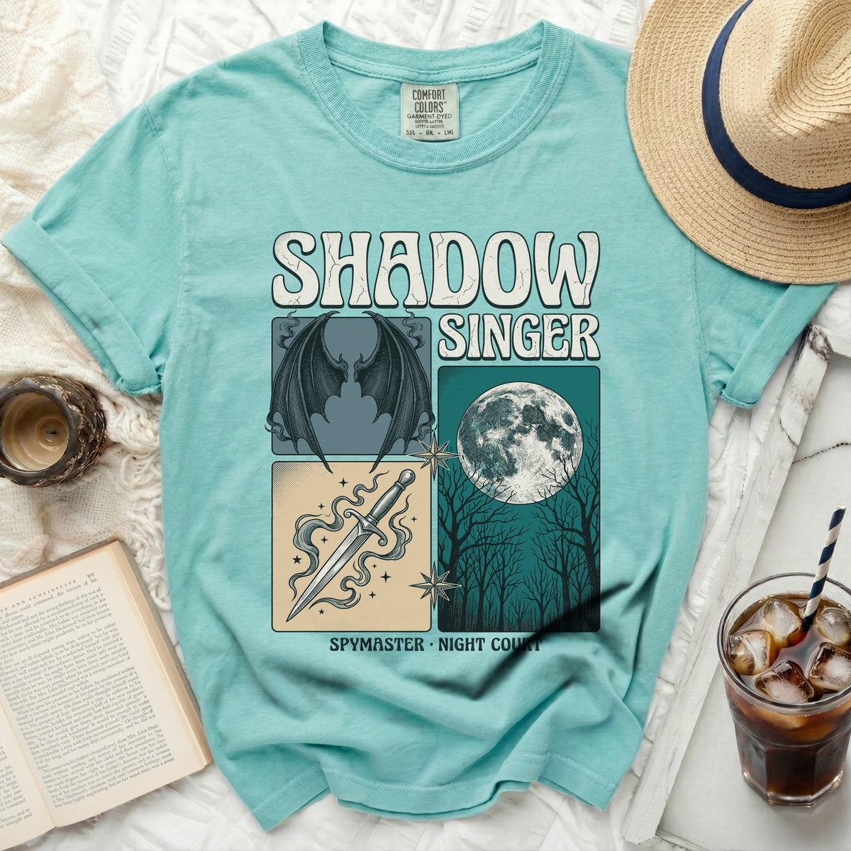 Aqua t-shirt with "SHADOW SINGER SPYMASTER NIGHT COURT" graphic.