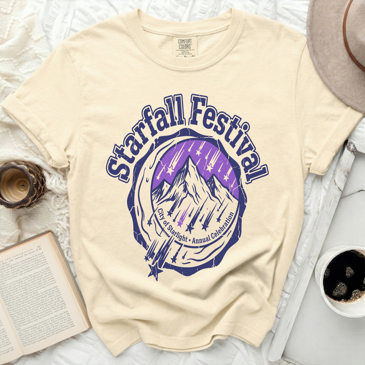 Cream t-shirt with "Starfall Festival City of Starlight Annual Celebration" graphic.