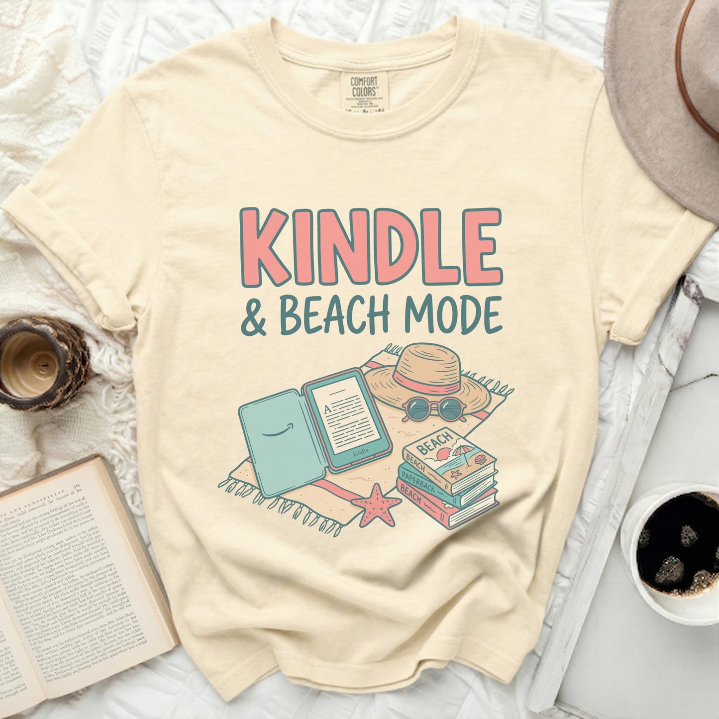 Comfort Colors graphic tee with "Kindle & Beach Mode" text and beach items.