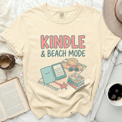 Comfort Colors graphic tee with "Kindle & Beach Mode" text and beach items.