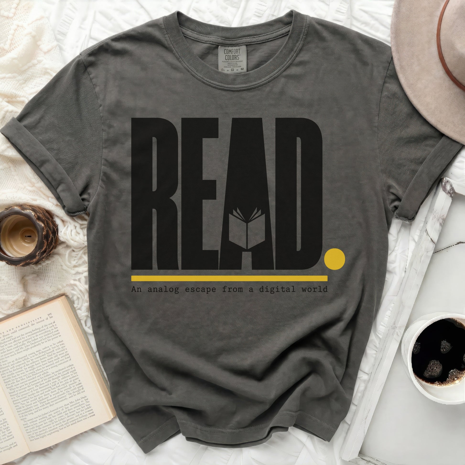 Dark grey t-shirt with "READ" and "An analog escape from a digital world."