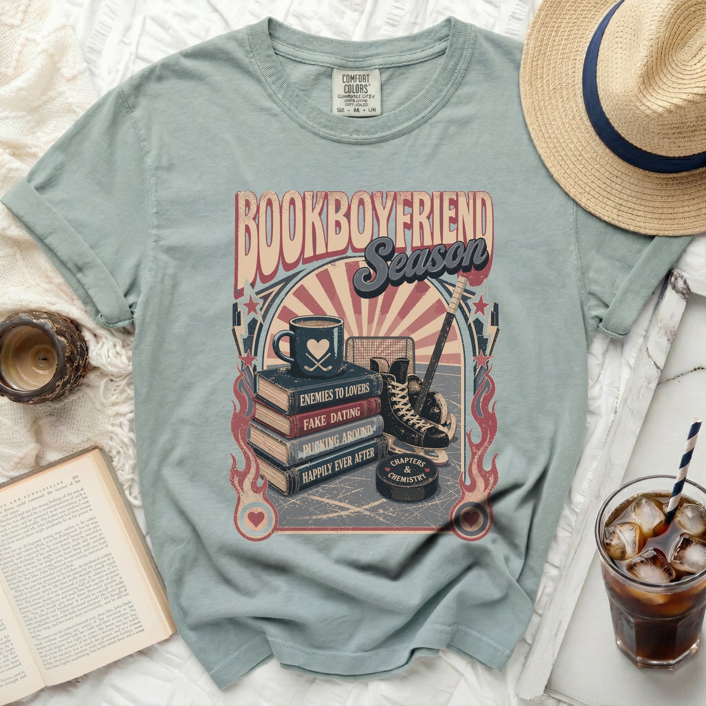 Comfort Colors t-shirt with book titles, hockey, and coffee cup graphic.