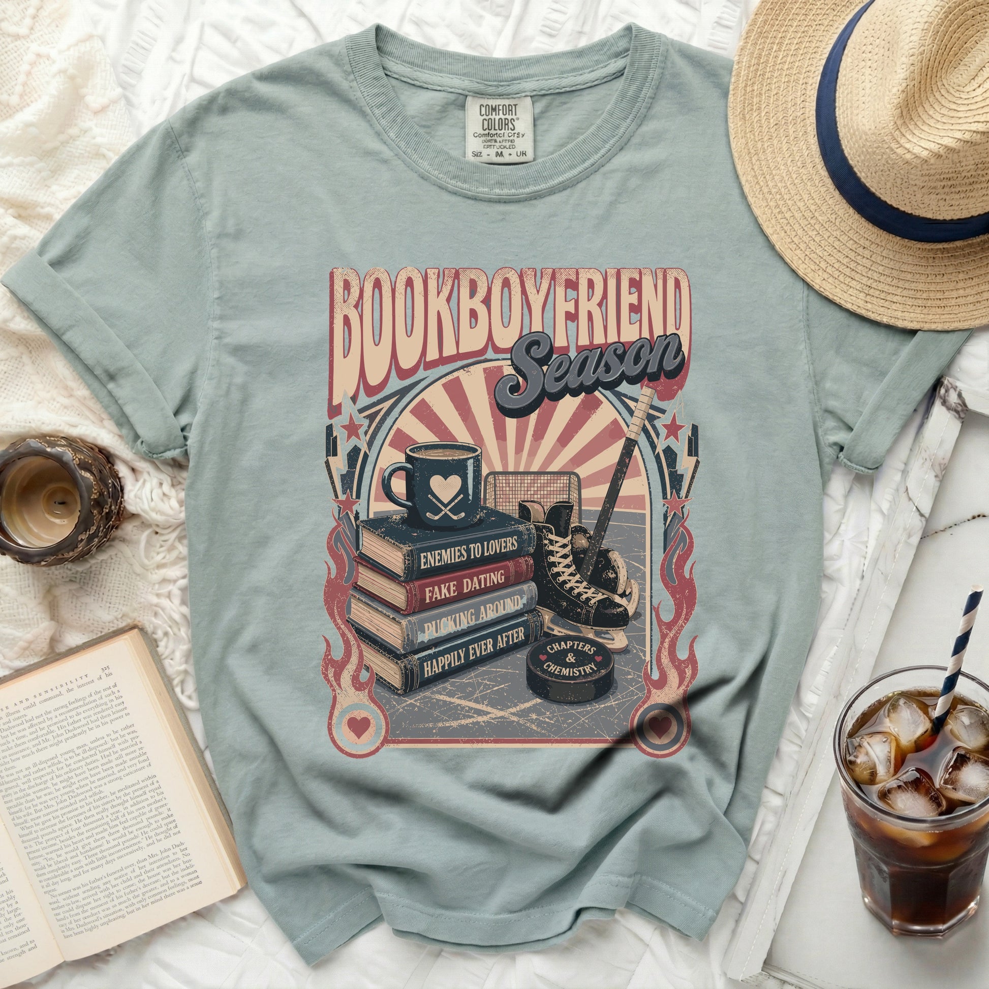 Comfort Colors t-shirt with book titles, hockey, and coffee cup graphic.