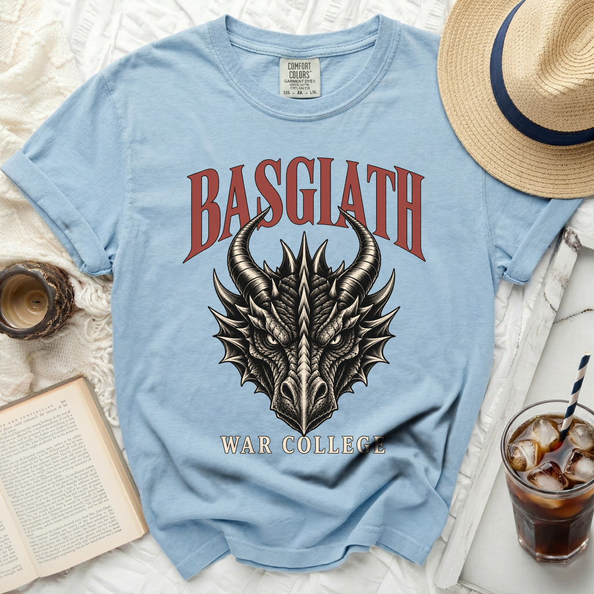 Light blue t-shirt with a dragon head graphic and "Basgiath War College" text.