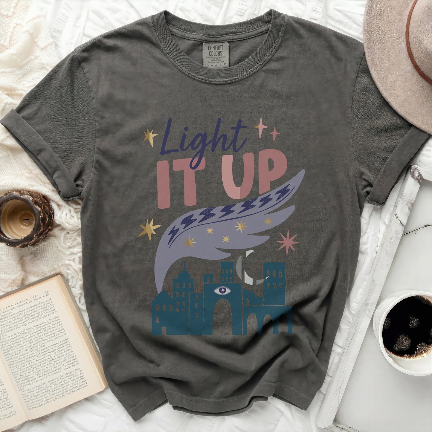 Comfort Colors dark t-shirt with "Light IT UP" and celestial graphic.