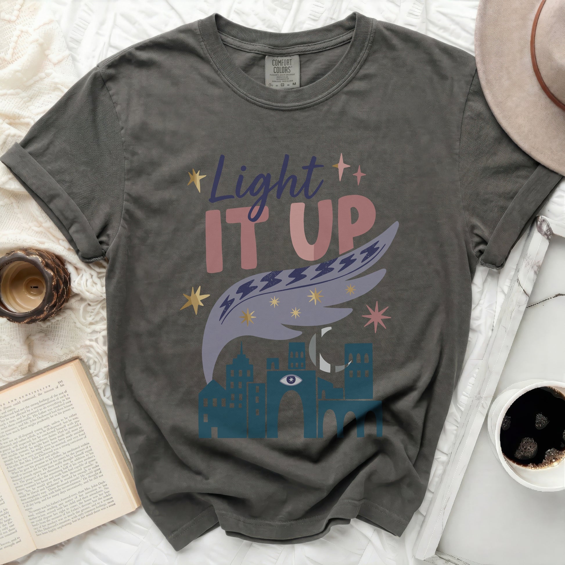 Comfort Colors dark t-shirt with "Light IT UP" and celestial graphic.