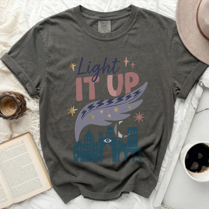 Comfort Colors dark t-shirt with "Light IT UP" and celestial graphic.