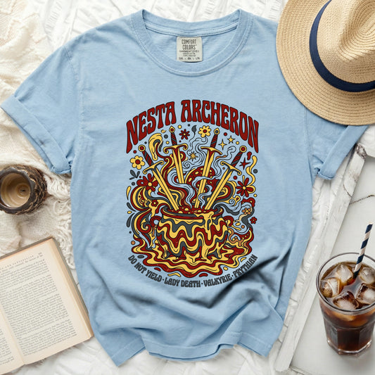 Light blue t-shirt with "Nesta Archerson" and sword cauldron graphic.
