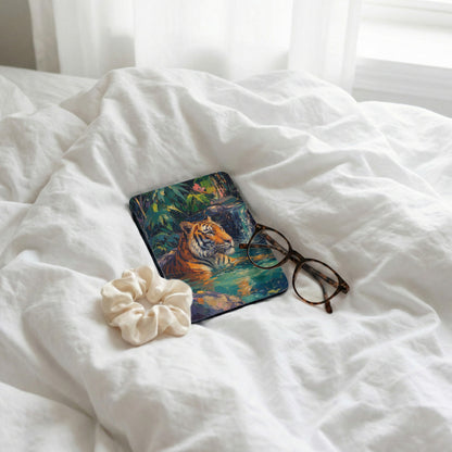 Tiger in lush jungle scene on protective case, with glasses and scrunchie.