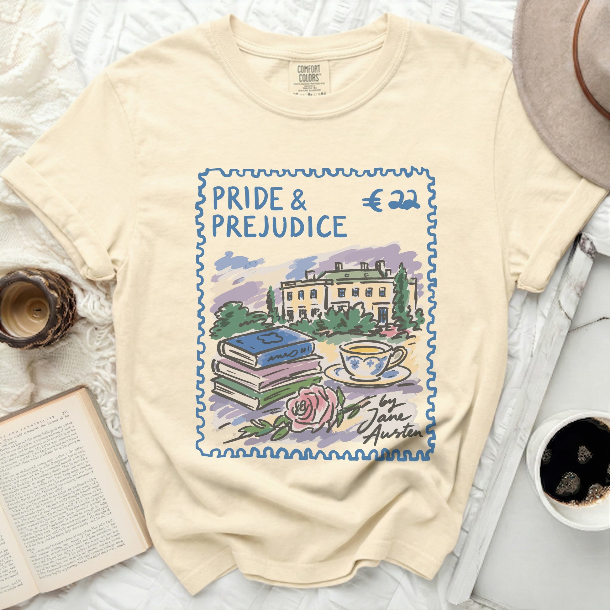 Pride and Prejudice graphic tee with books, rose, and teacup postage stamp design.