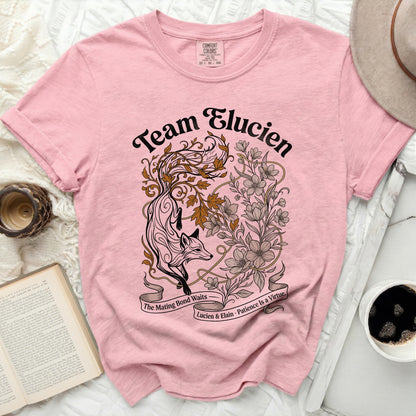 Pink t-shirt with "Team Elucien" text and fox and floral design.