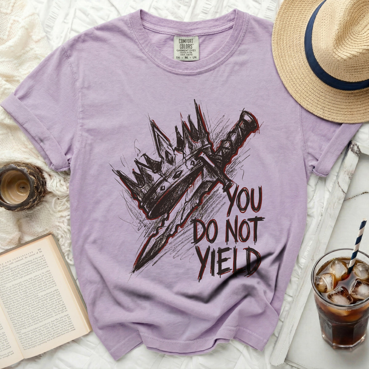 Purple t-shirt with "YOU DO NOT YIELD" and a crown and sword graphic.