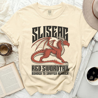 Cream t-shirt with red dragon graphic and text "SLISEAG RED SWORDTAIL BONDED TO SAWYER HENRICK".