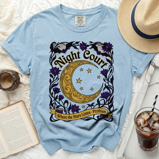 Light blue t-shirt with "Night Court" and moon graphic.