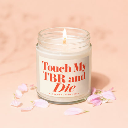 Candle with text "Touch My TBR and Die" and "MAGICMERCHEMPORIUM" logo.