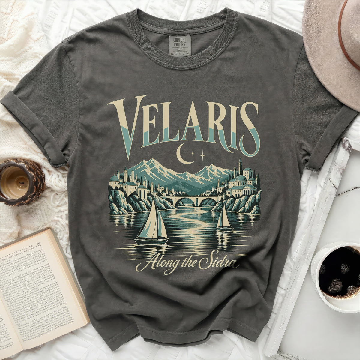 Gray t-shirt with "Velaris Along the Sidra" text and cityscape graphic.