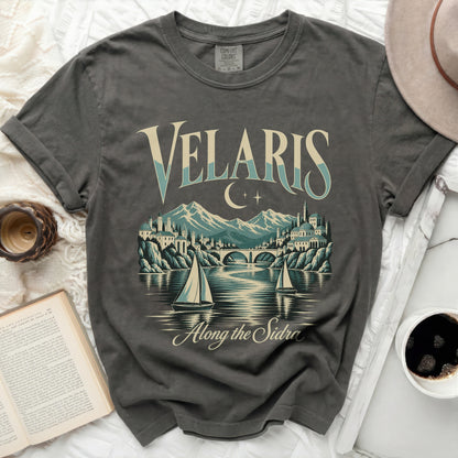Gray t-shirt with "Velaris Along the Sidra" text and cityscape graphic.