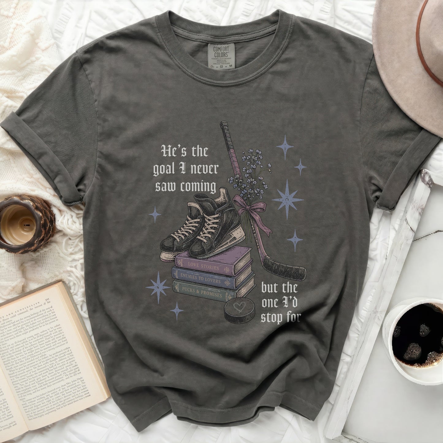 Dark grey t-shirt with "He's the goal I never saw coming" and hockey elements.