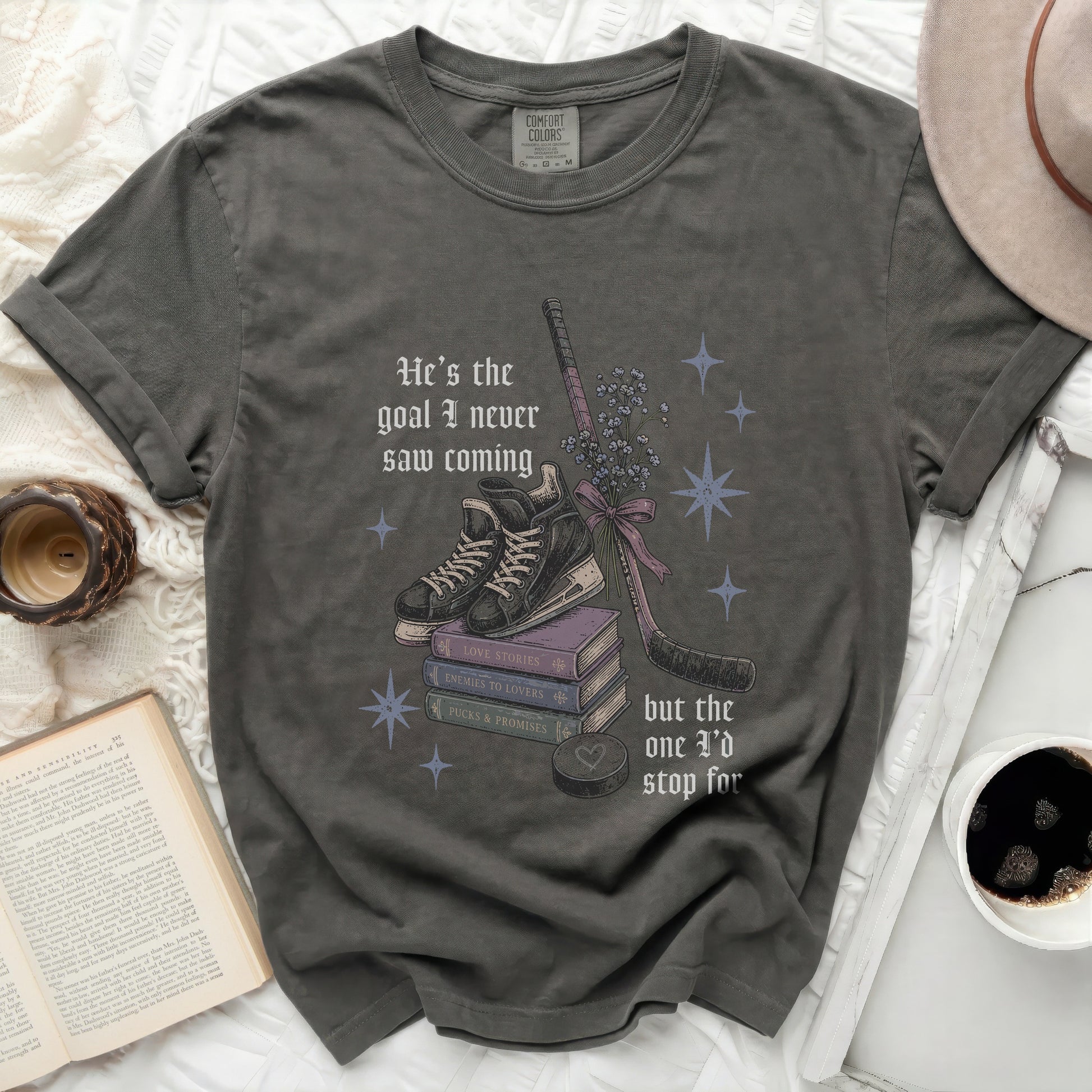 Dark grey t-shirt with "He's the goal I never saw coming" and hockey elements.