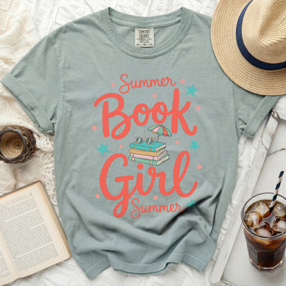 Light teal t-shirt with "Book Girl Summer" graphic and book stacks.