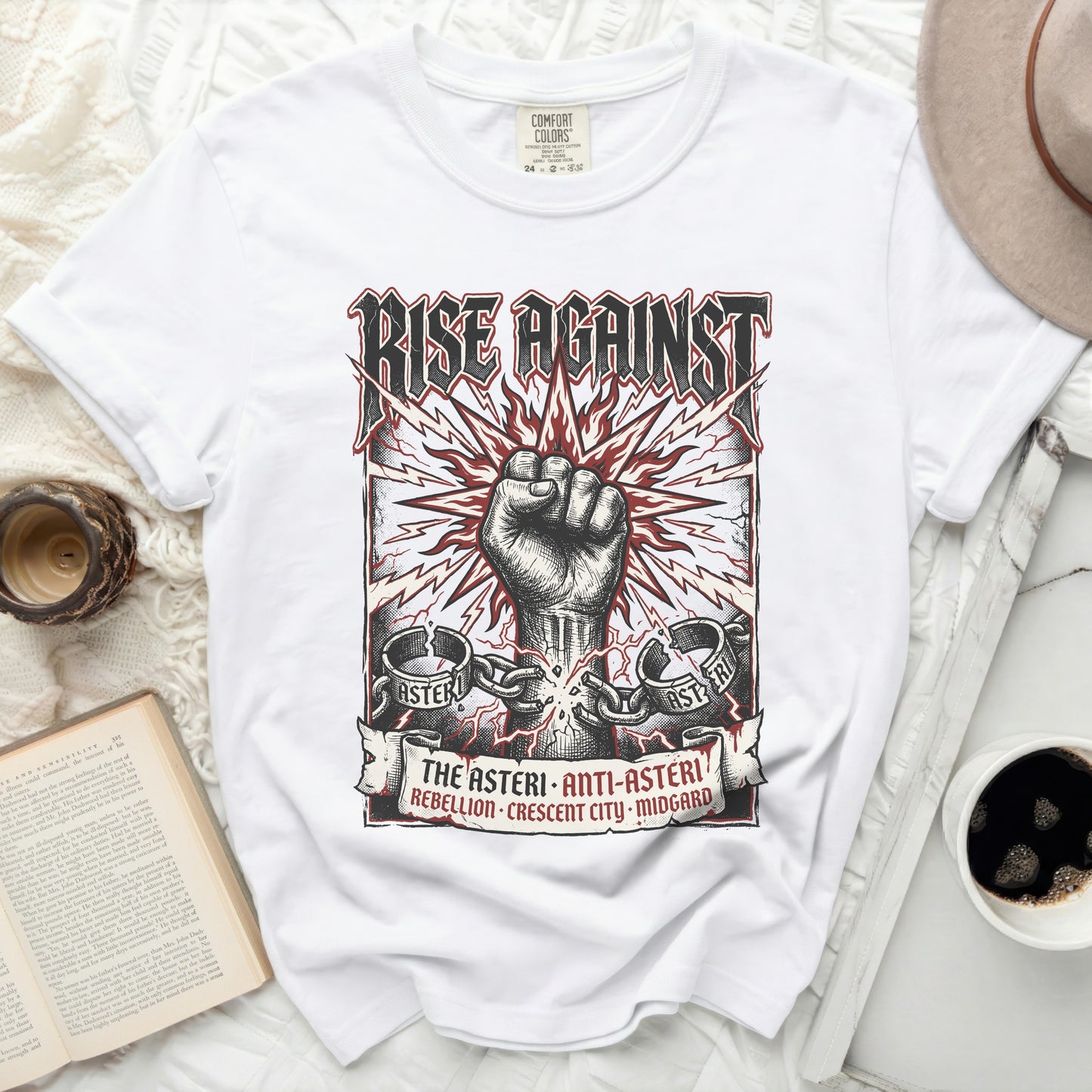 White t-shirt with "Rise Against" logo and band-themed graphic.