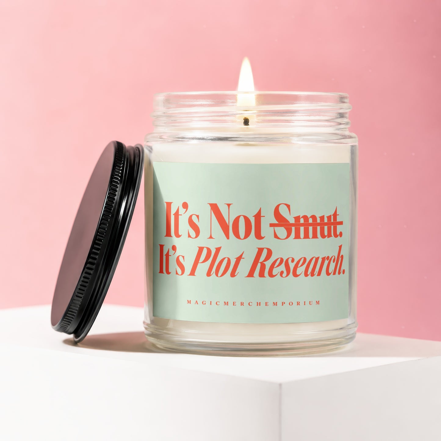 Candle with "It's Not Smut. It's Plot Research." text on a light green label.