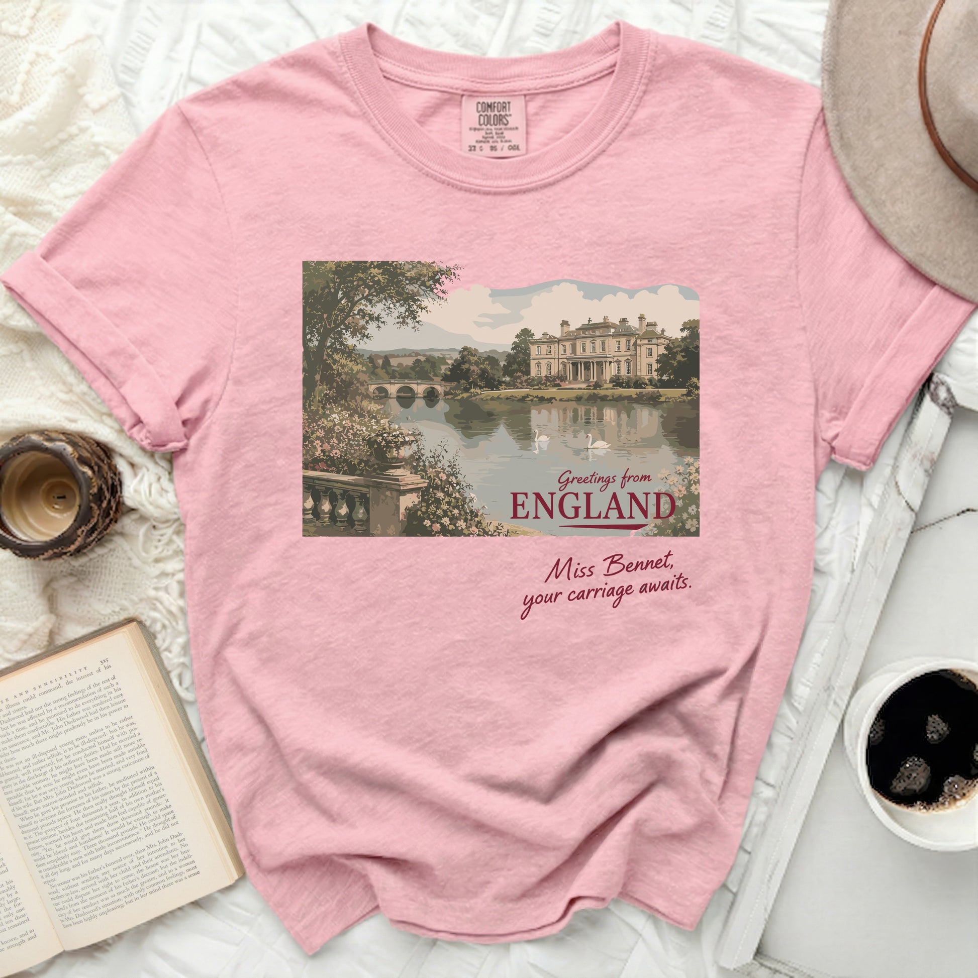 Pink Comfort Colors shirt with "Greetings from England" and "Miss Bennet, your carriage awaits" graphic.