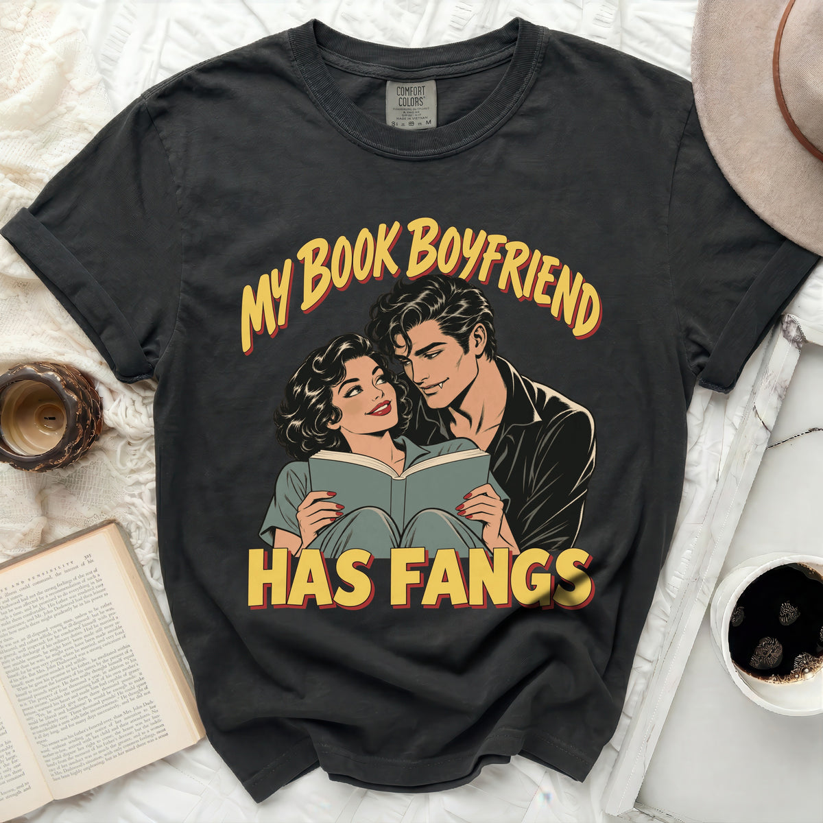 Dark grey t-shirt with "My Book Boyfriend Has Fangs" text and comic illustration.