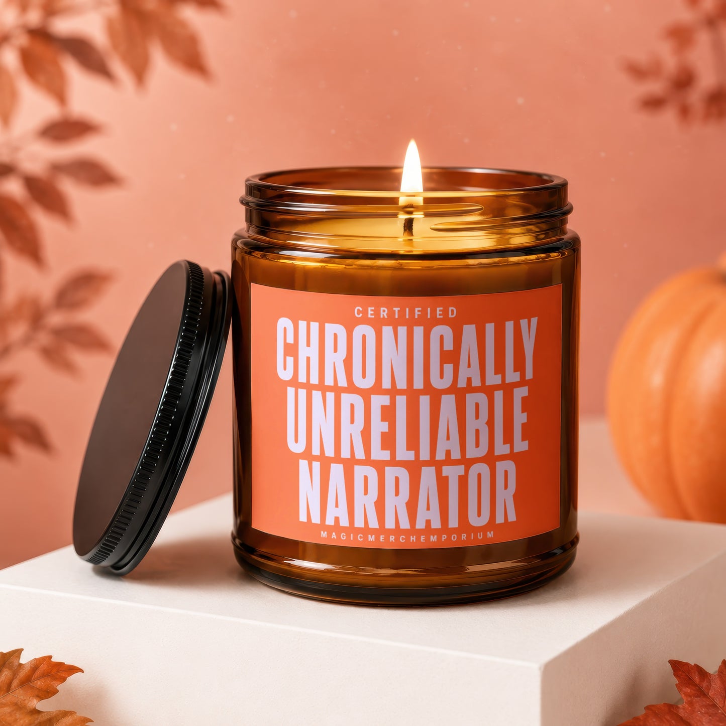 Amber jar candle with "Certified Chronically Unreliable Narrator" text, lit wick.