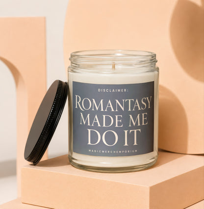 Glass candle with black lid and "Romantasy Made Me Do It" label.