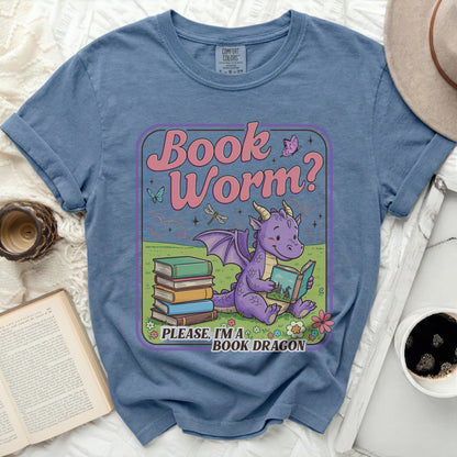 Purple dragon reading a book with text "Book Worm? Please, I'm a Book Dragon."