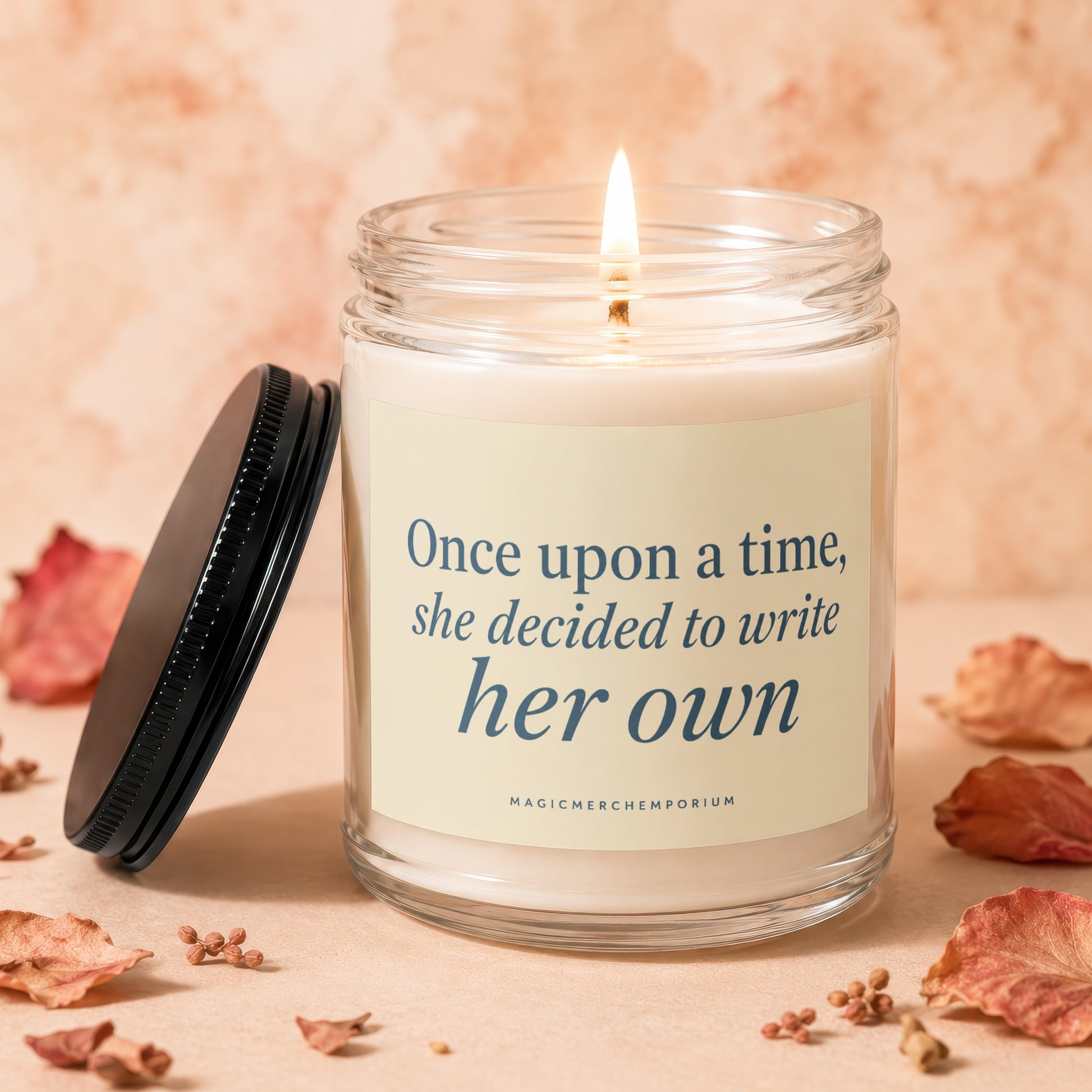 Burning candle with "Once upon a time, she decided to write her own" text.