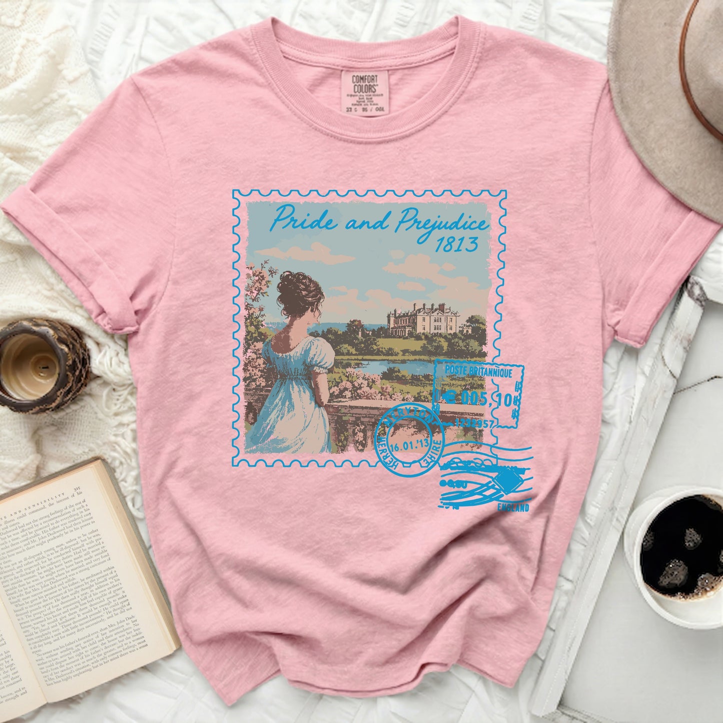 Pink t-shirt with a stamp design of "Pride and Prejudice 1813".