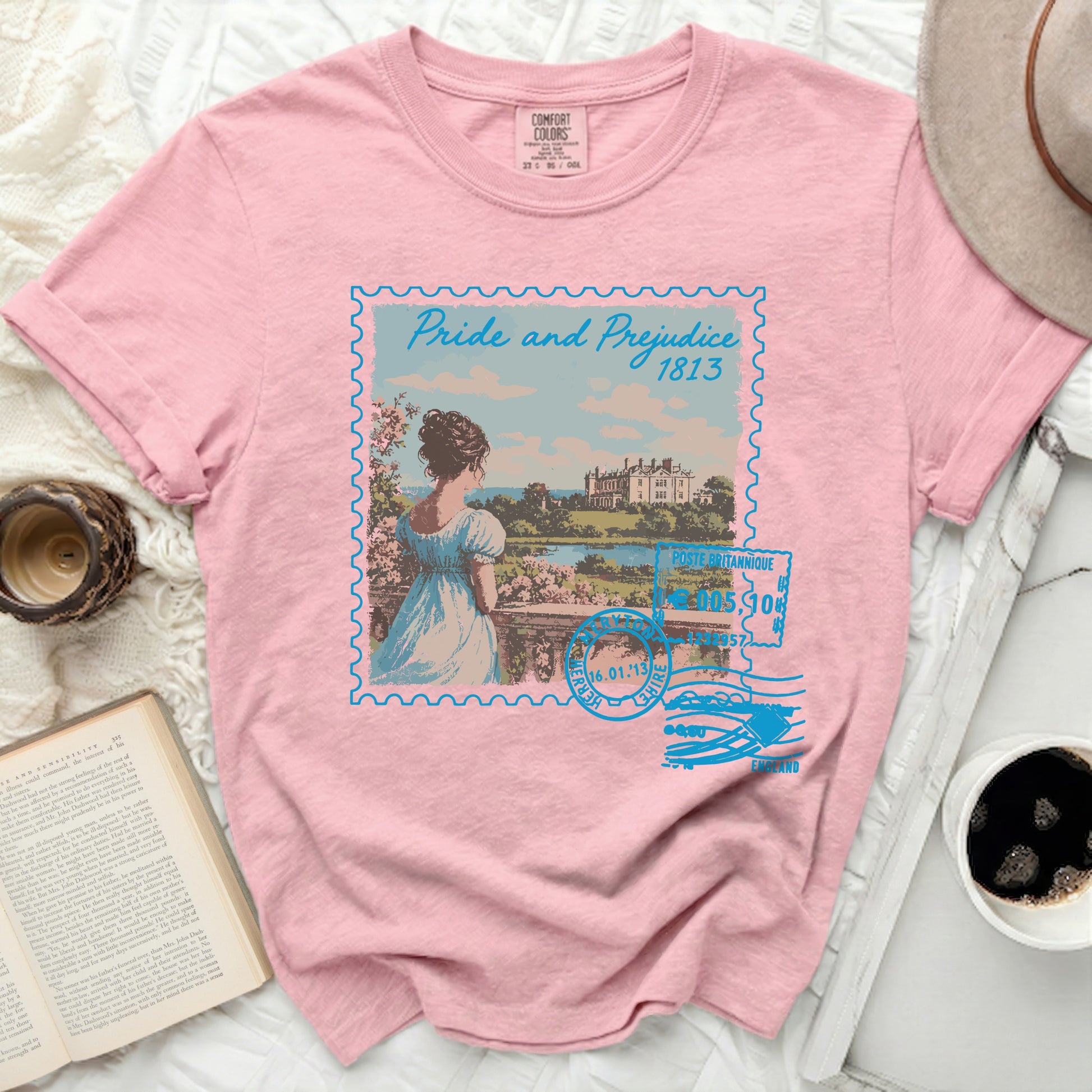 Pink t-shirt with a stamp design of "Pride and Prejudice 1813".