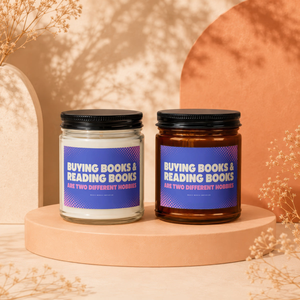 Two candles with labels reading "Buying Books & Reading Books Are Two Different Hobbies".
