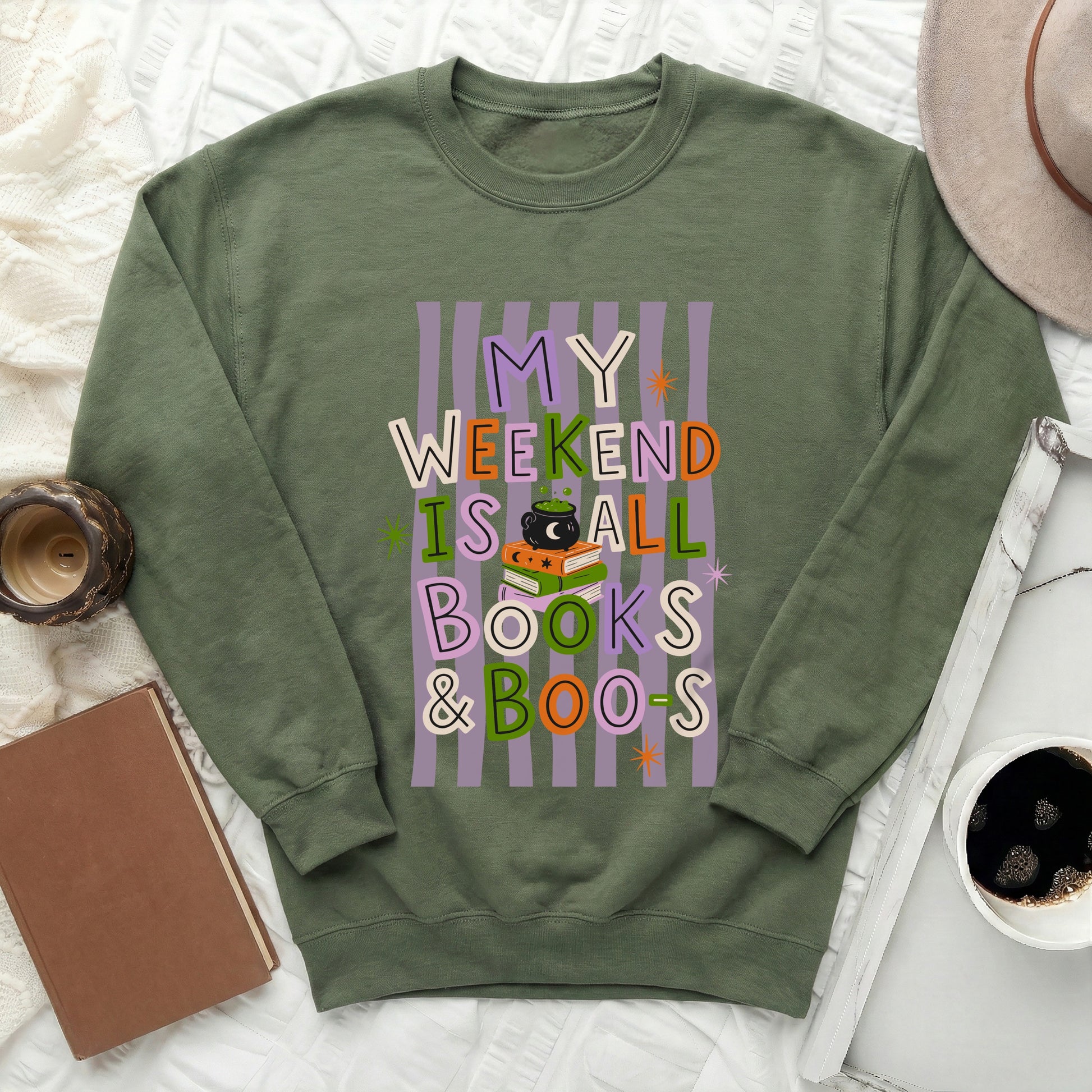 Green sweatshirt with text "MY WEEKEND IS ALL BOOKS & BOO-S" and Halloween graphics.