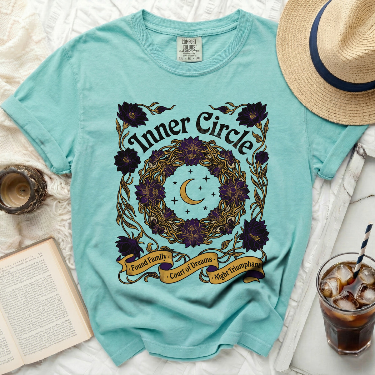 Teal t-shirt with "Inner Circle" text and floral wreath design.