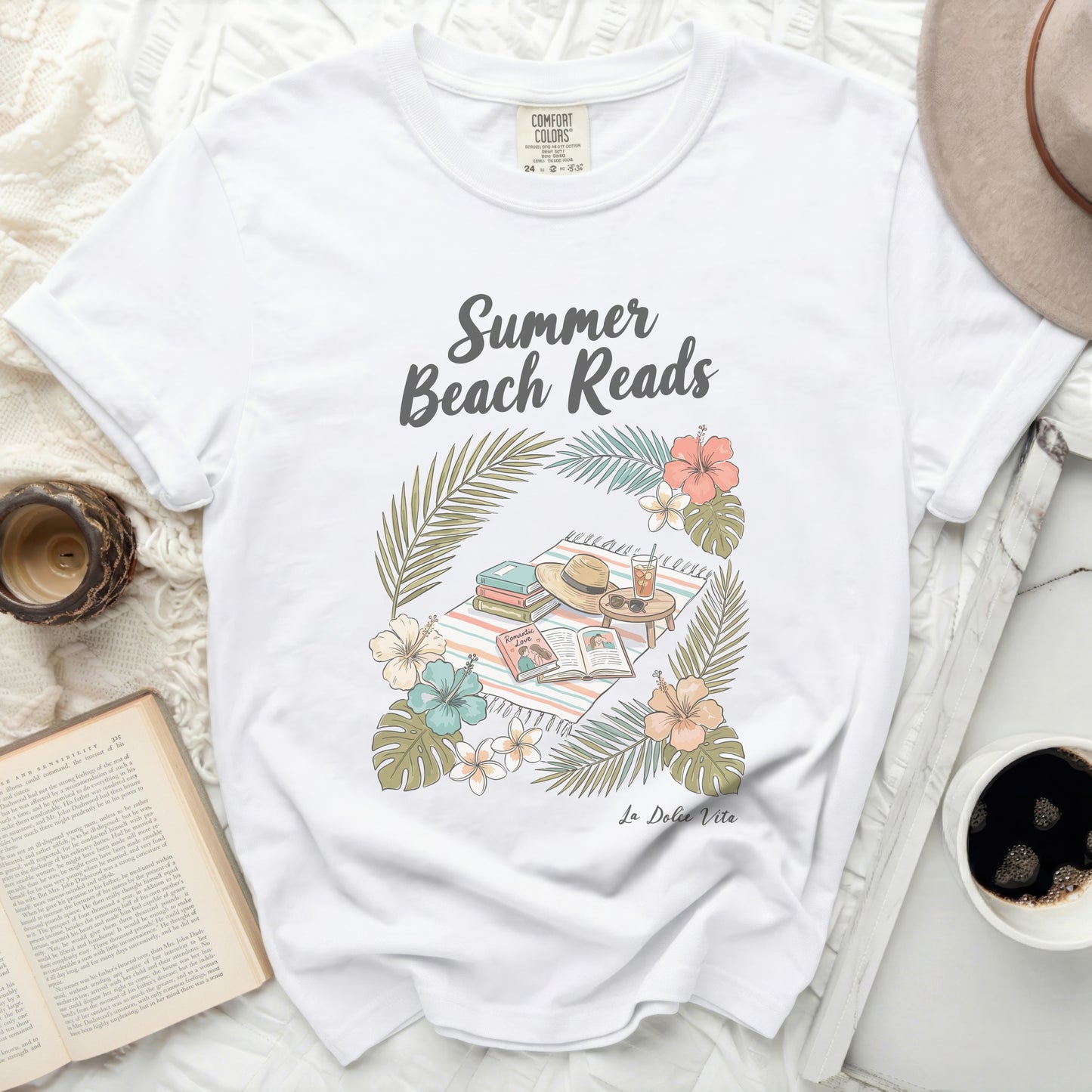 White t-shirt with "Summer Beach Reads" floral graphic and "La Dolce Vita" text.
