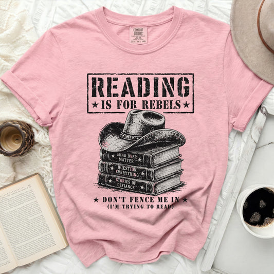 Pink t-shirt with a cowboy hat on a stack of books and rebel text.