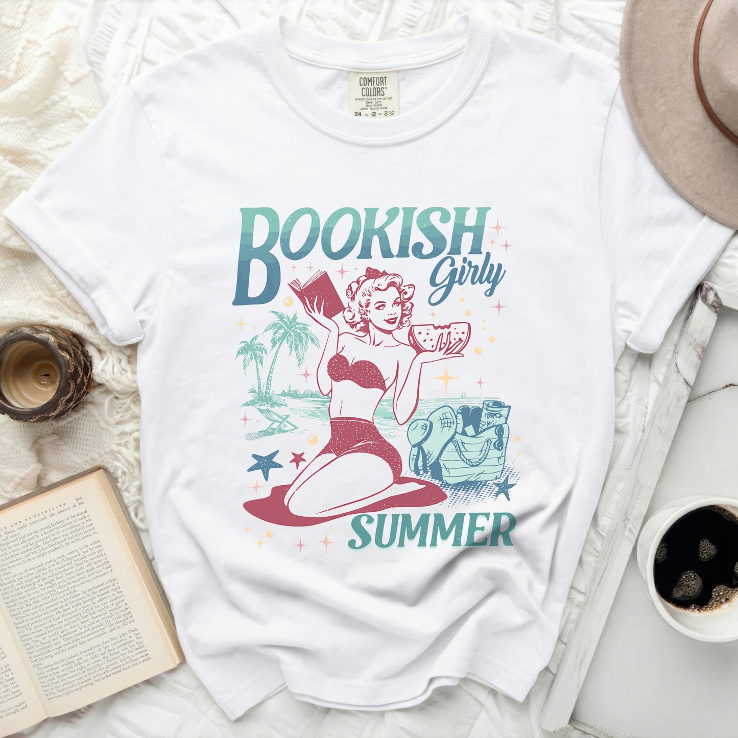 White t-shirt with "Bookish Girly Summer" graphic of a woman reading.