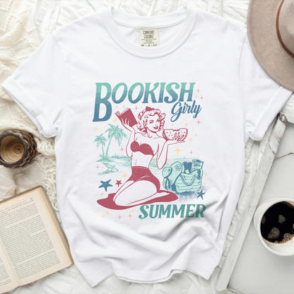 White t-shirt with "Bookish Girly Summer" graphic of a woman reading.
