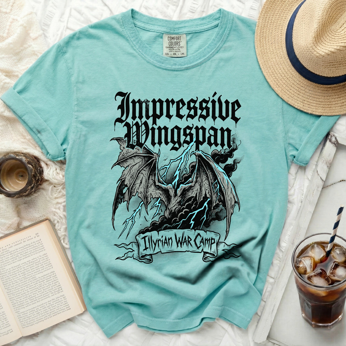 Teal t-shirt with black dragon, lightning, and text "Illyrian War Camp".